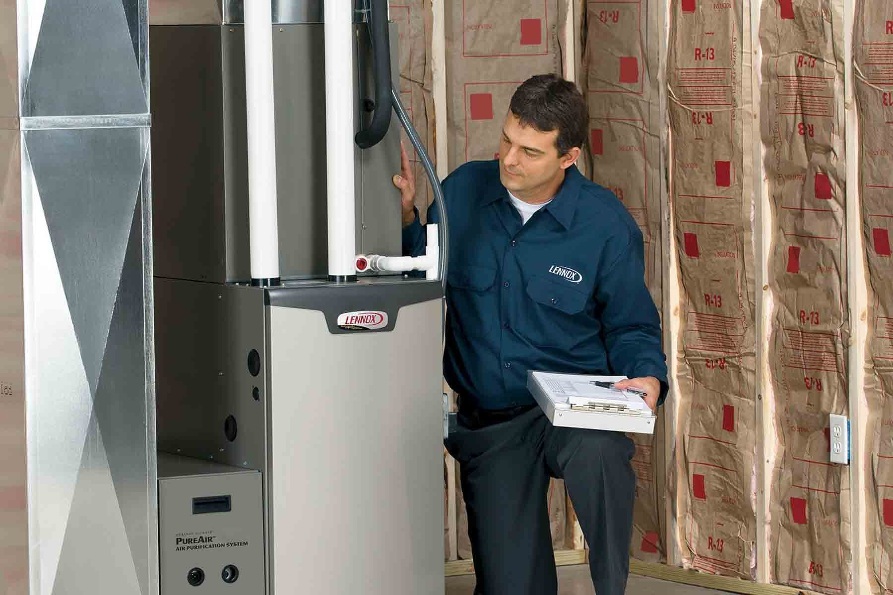 homeguide-lennox-furnace-expert-installing-new-furnace-in-home